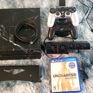 PS4. 2 cntrls, charge station, cooler, & games